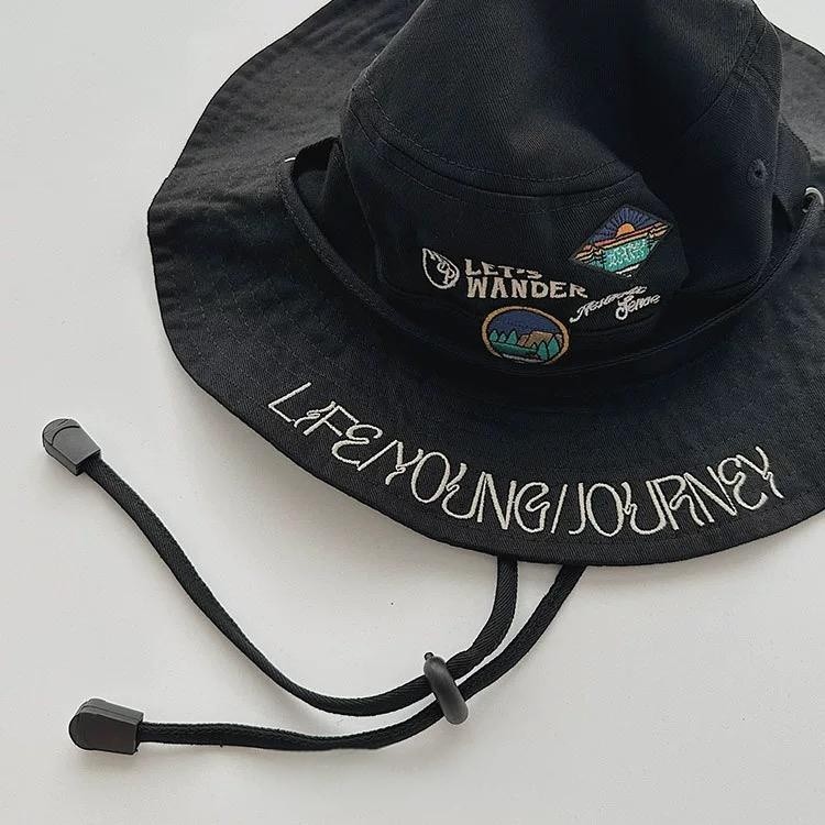 Men's Black Bucket Hat With String Nearby